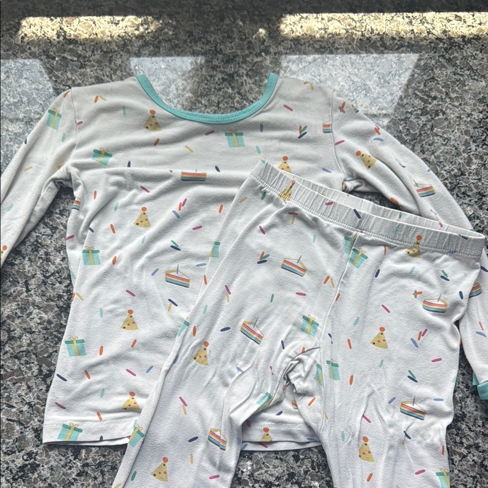 Kyte BABY White and Blue Pajama Sets with Playful Dinosaur Print